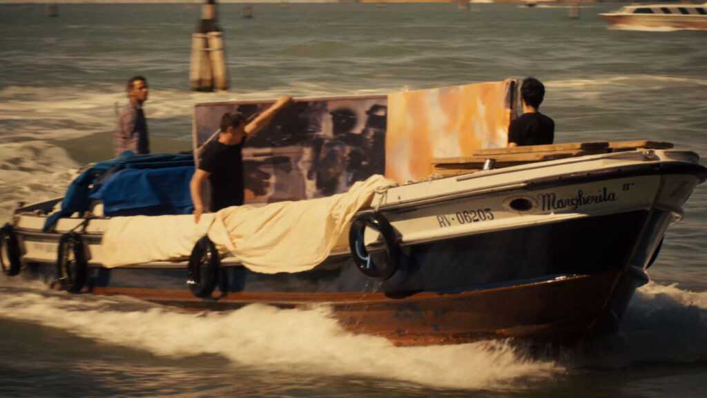 Recreation of the 1964 transport of Robert Rauschenberg’s work in Venice canals for exhibition at the Venice Biennale, as seen in TAKING VENICE, a film by Amei Wallach. A Zeitgeist Films release in association with Kino Lorber.